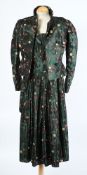 A green silk and floral two-piece skirt suit together with a green velvet dress,