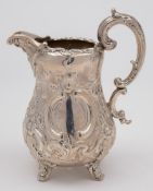 A Victorian silver cream jug, maker Edward & John Barnard, London, 1867: of baluster form,