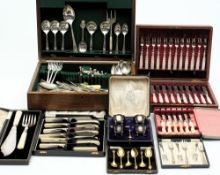 A pair of plated fish servers: cased,