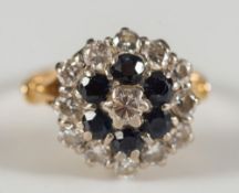 An 18ct gold, diamond and sapphire circular cluster ring:,