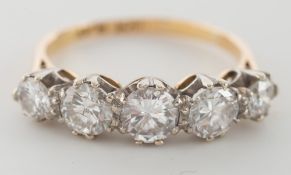 An 18ct gold and diamond five stone ring: with graduated, circular,