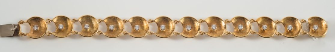 An 18ct gold and diamond bracelet of textured crescent moon links each claw-set with a single