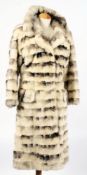 An 'RW' long fur coat and five other fur coats:.