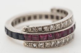 A diamond, ruby and sapphire swivel shank eternity ring:,