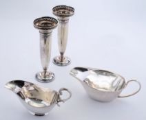 Two silver plated specimen vases: 17cm. high together with two sauce boats.