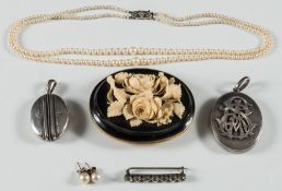 A Victorian jet and carved ivory oval buckle, converted to a brooch,