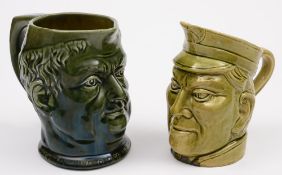 Two Watcombe (Torquay) pottery face jugs: comprising an unusual example modelled in the form of a