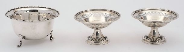 A pair of silver bon bon dishes, and a sugar basin,