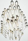 A collection of assorted English and foreign silver spoons : various makers and dates including