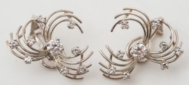 A pair of 18ct white gold and diamond mounted spray clip earrings: each with a circular,
