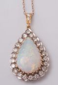 An opal and diamond pear-shaped pendant:, the opal approximately 22mm long,