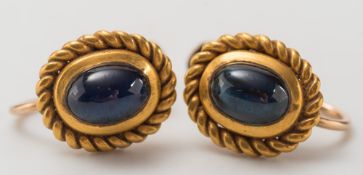 A pair of cabochon sapphire, screw back earrings:,