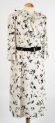 A white and black patterned chiffon dress together with seven other various outfits:.