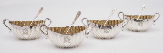 A set of four Victorian silver oval twin handled salts, maker HA, Sheffield, 1890: monogrammed,