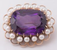 An amethyst and cultured seed pearl oval brooch:,