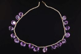 An early 20th century amethyst and seed pearl fringe necklace: with seventeen round and oval