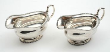 A pair of Elizabeth II silver sauceboats, maker S.