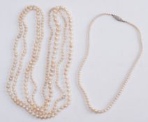 A graduated cultured pearl long single string necklace and a smaller single-string necklace with