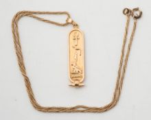 A gold Egyptian ingot pendant:, approximately 9.5gms gross weight.