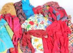 A collection of brightly printed cotton and silk clothing and fabric:, etc.