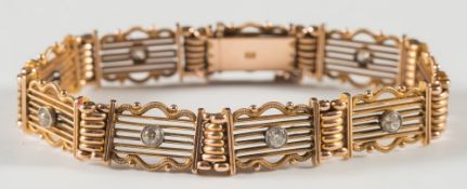A 15ct gold and diamond set gate-link bracelet:, each panel set with a circular,