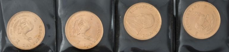 Four South African krugerrands, all dated 1975:.