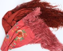 A Chinese red silk shawl with floral embroidered decoration with fringe border,
