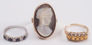 A sapphire and diamond mounted seven stone half-hoop ring,