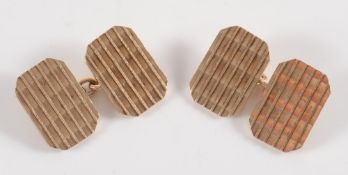 A pair of 9ct gold rectangular panel cuff-links:.