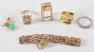 A 9ct gold gate-link bracelet, three gem set rings and two gold pendants:.