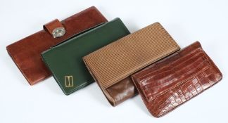 A green 'leather' clutch bag and three others:.