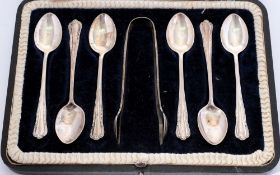 A set of six silver coffee spoons and matching sugar tongs: cased, 2.80ozs.