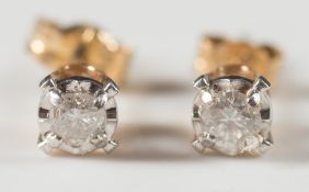 A pair of diamond single stone ear studs:, approximately 0.20ct total diamond weight.
