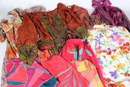 A collection of brightly printed cotton and silk clothing and fabric:, etc.