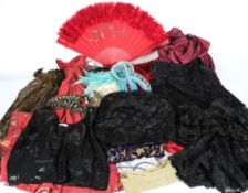 A large mixed group of accessories including lace, silk, beadwork, bright feather boas,