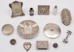 An Indian silver ashtray and a matchbox case:, a silver mounted desk calendar, a silver cover,
