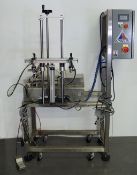 Apacks dual head liquid filling system. Rated from 20 to 60 fills per minute
depending upon fill