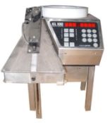 Kirby Lester electronic vibratory counter. Will count tablets, capsules, softgels,
candies and