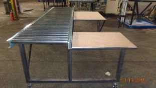 Packing table with 10 ft  roller conveyor on wheels.  Width of conveyor is about 32