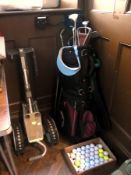 Quantity of various golf clubs and a sho
