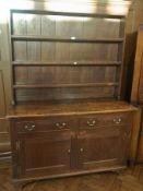 Oak dresser having three-tier plate rack