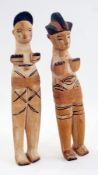 Two pairs of carved wooden Nigerian male