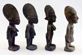 Two pairs of carved wooden Nigerian male