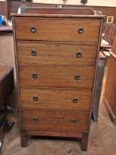 Stained mahogany chest of four long grad