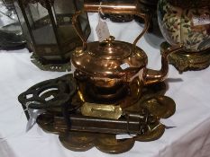 An iron trivet, pocket balance, two spri