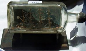 An early 20th century full mast ship in