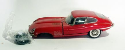 A monogram model E-Type Jag and three bo