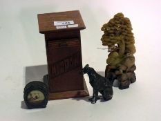 Soapstone carving of a tree and a bird,