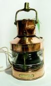 A ship's style copper lantern with a bra