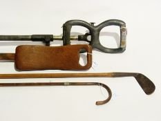 Two shooting sticks, one metal the other